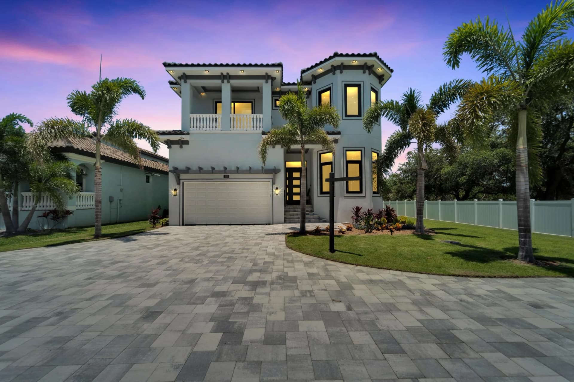 Evening exterior with architectural and entry lighting