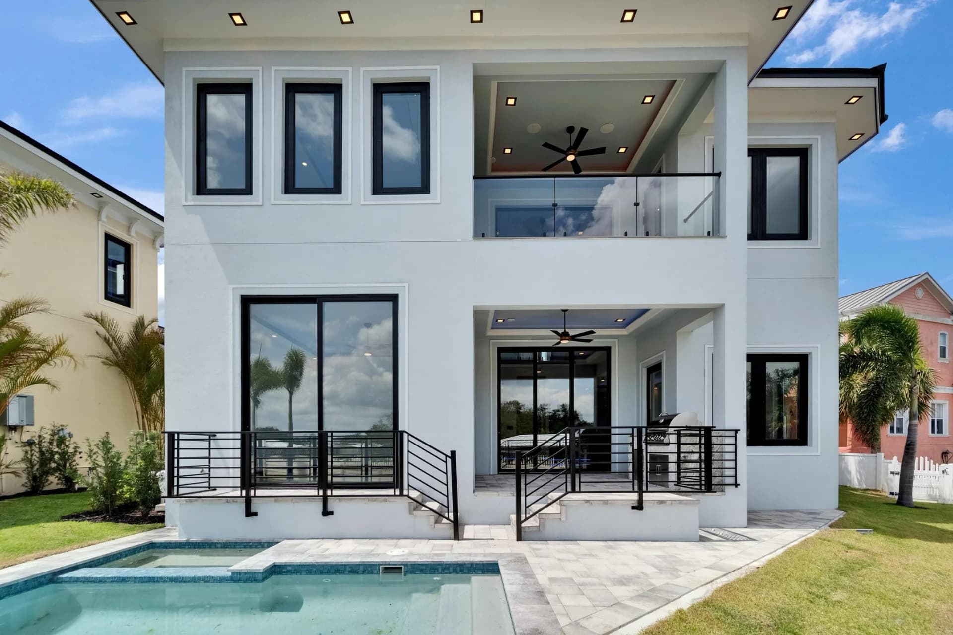 Poolside rear elevation and covered terrace at Simone Shores