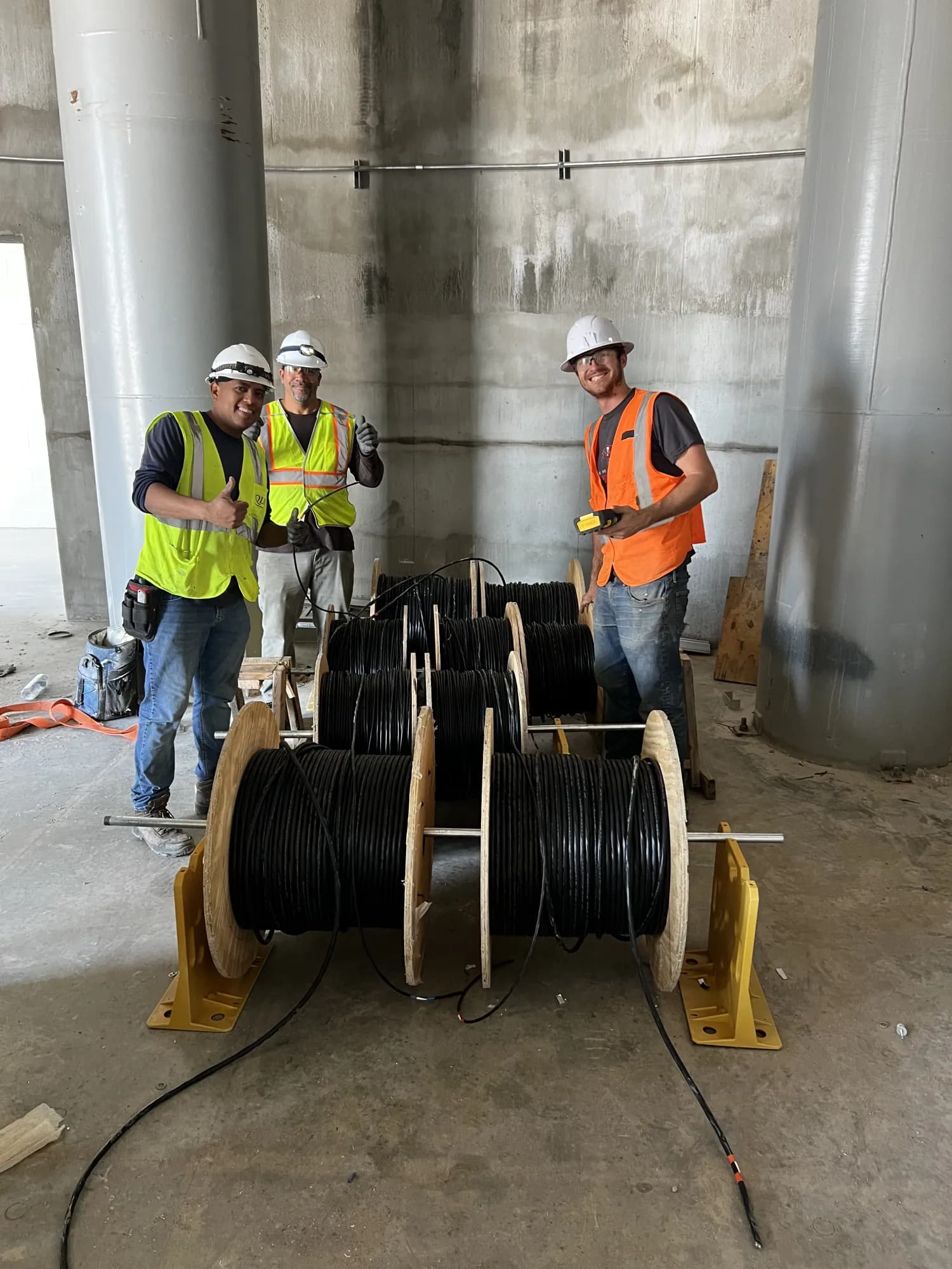 Verga Electric crew wearing hard hats and high-visibility vests during a commercial wire pull